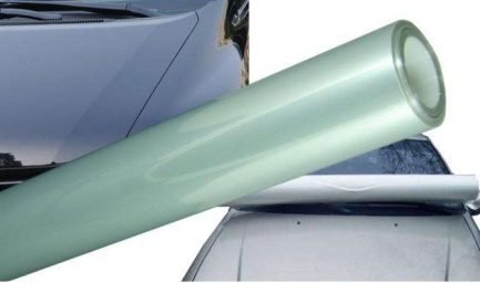 Paint protection film roll being positioned on a car hood