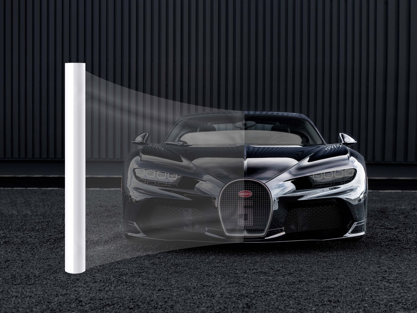 Clear TPU paint protection film pulled from a roll across the body of a sports car