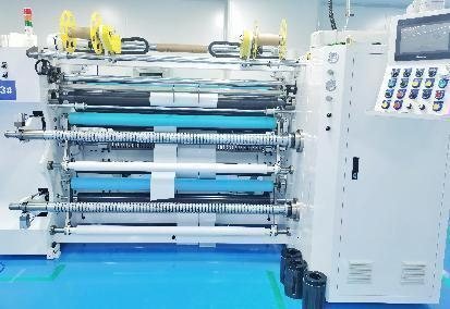 Slitting and rewinding machine loaded with film